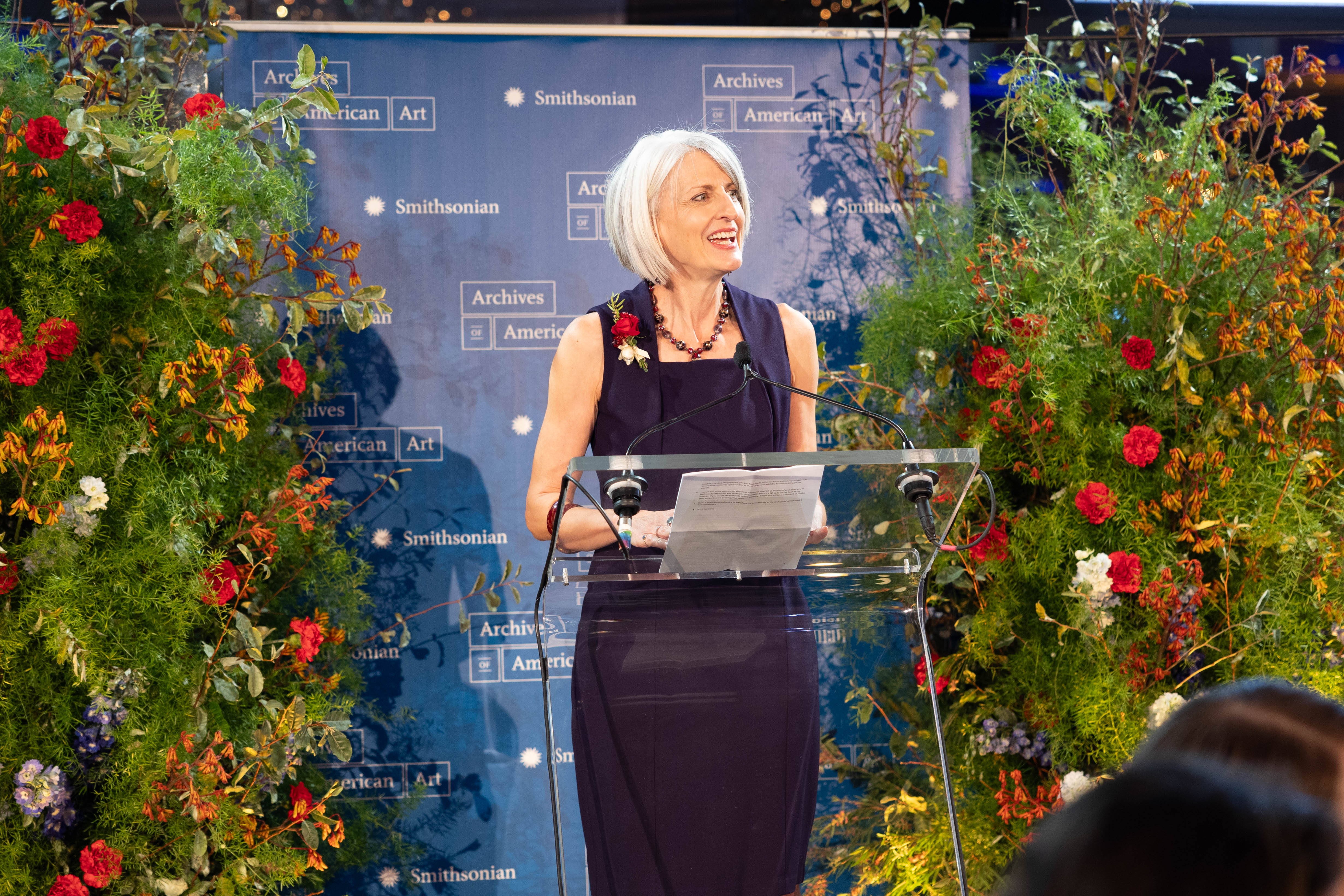 Anne Helmreich giving a speech in the Rainbow Room