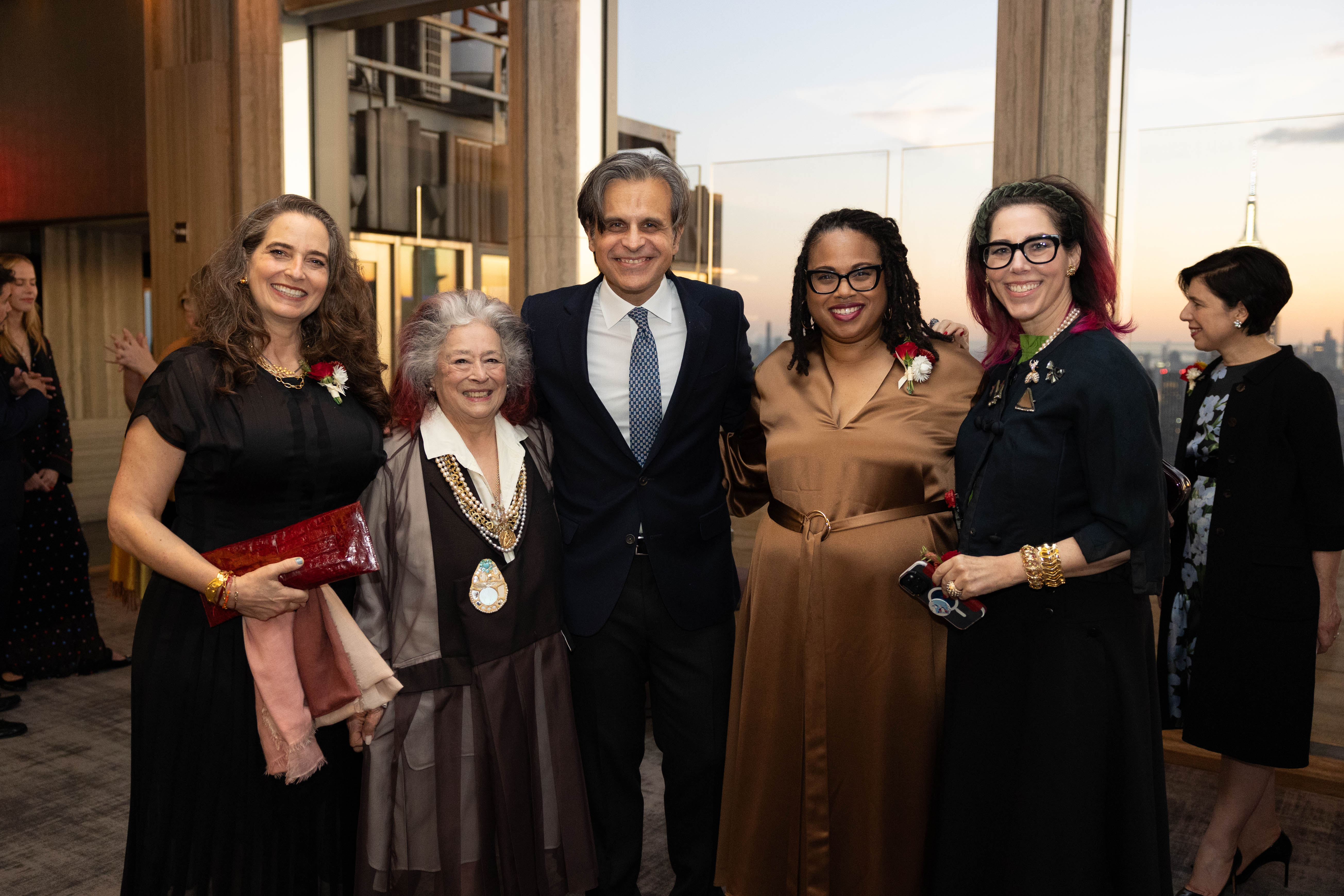 Alexandra May, Joan Agajanian Quinn, Salvador Salort-Pons, Louisa Gloger, and Amanda Quinn Olivar pose for a photo during the cocktail hour.