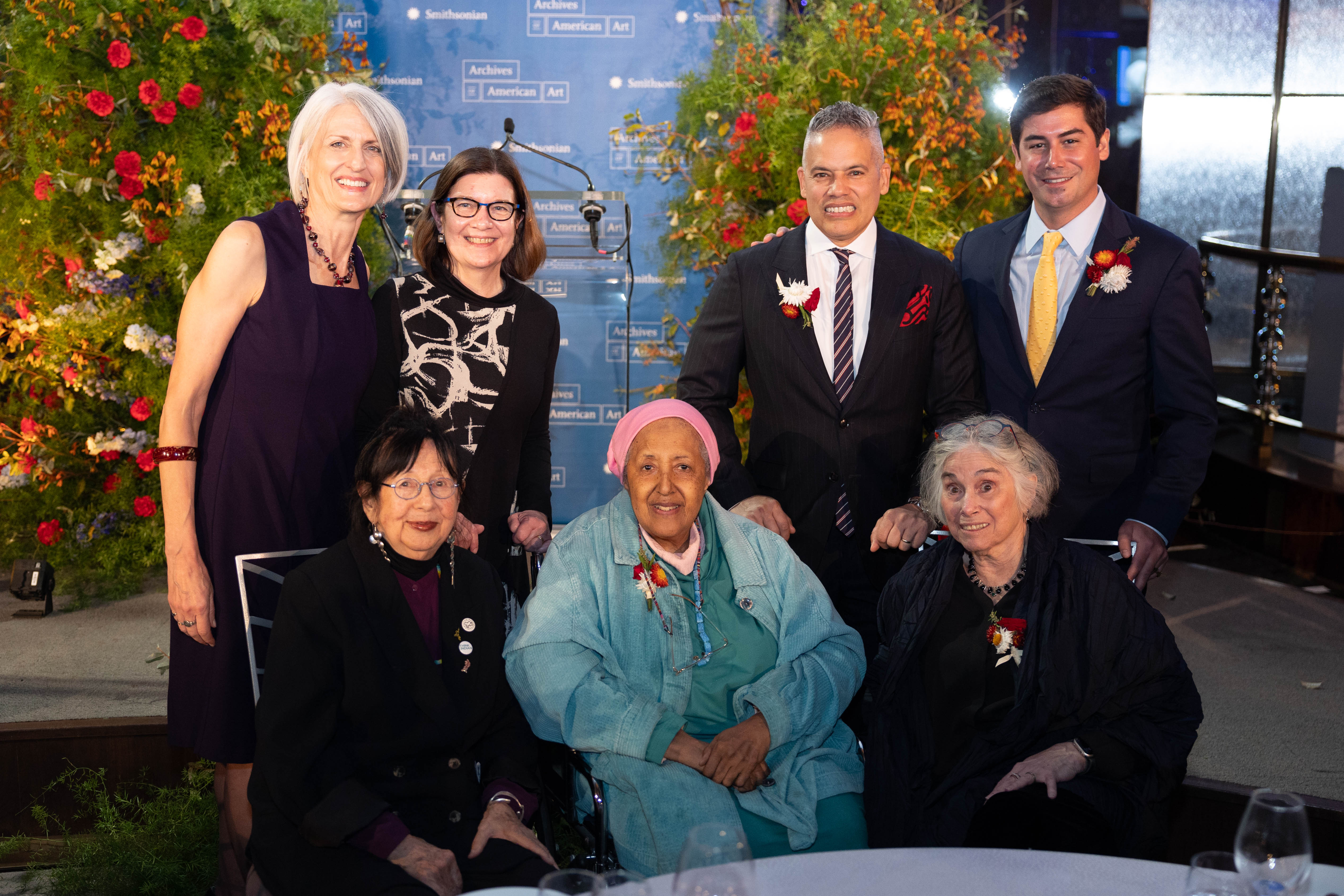 Posed photo of Honorees and speakers post award ceremony in Gala