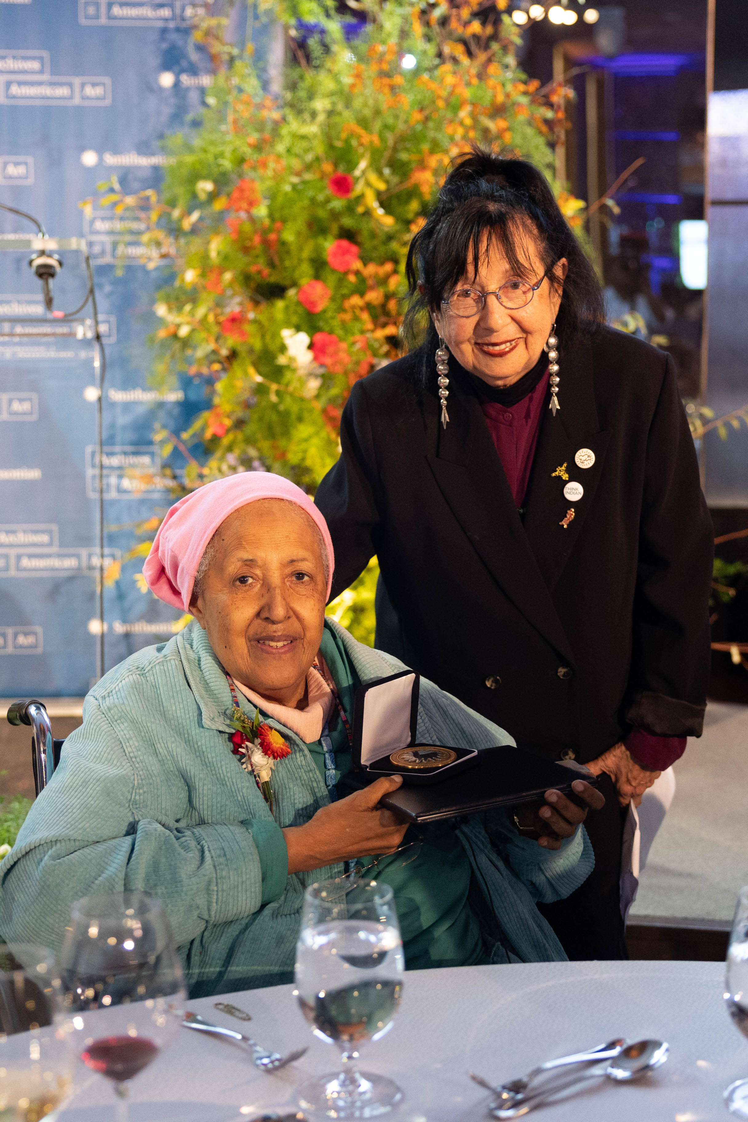 Jaune Quick-to-See Smith and Howardena Pindell pose for a photo after Jaune receives her award