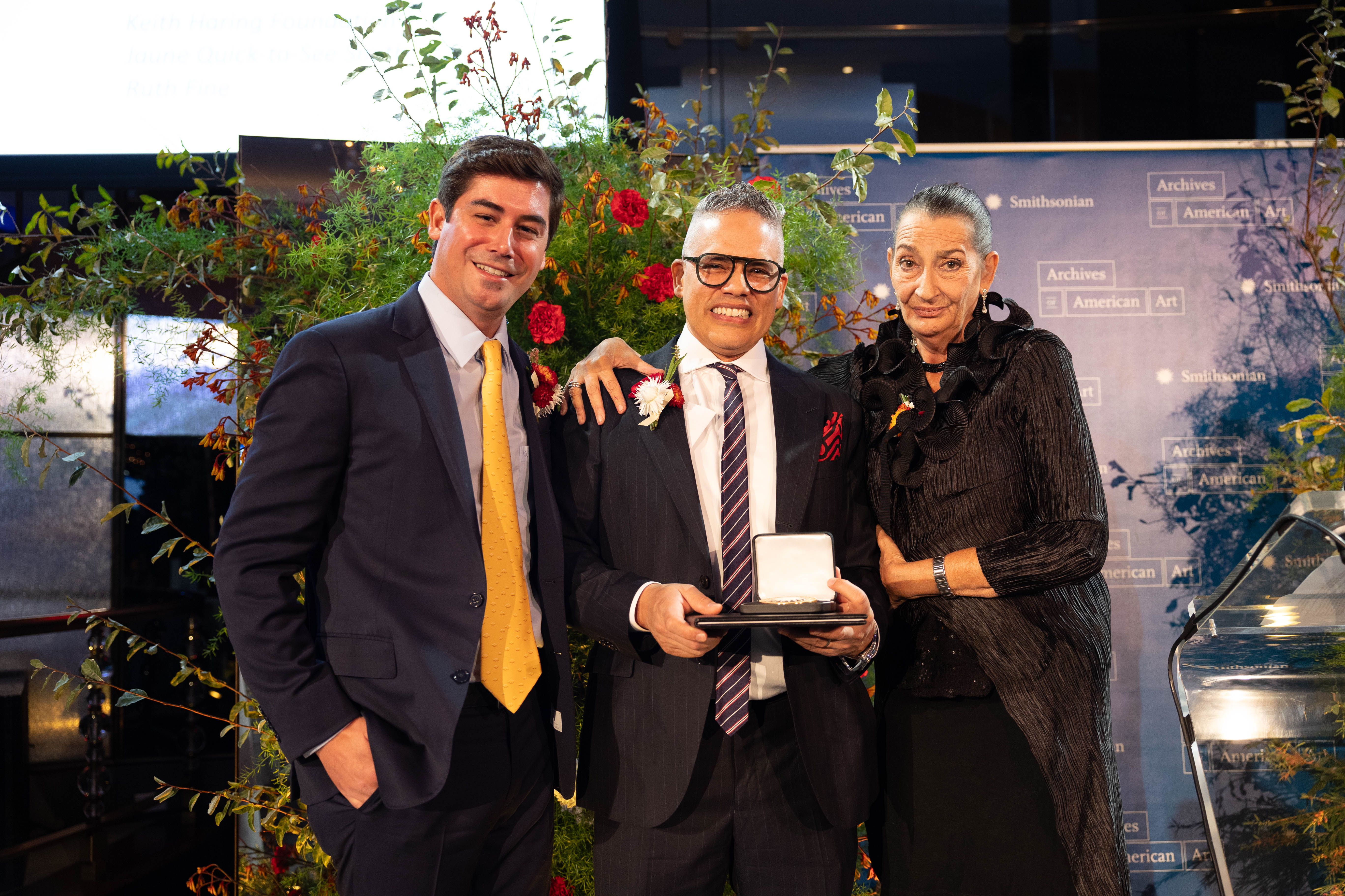 George Frederick Mead Merck, Gil Vazquez, and Julia Gruen pose for a photograph during after receiving their award.