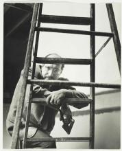 Black and white photograph of Mark Rothko with unfolded ladder in the foreground.